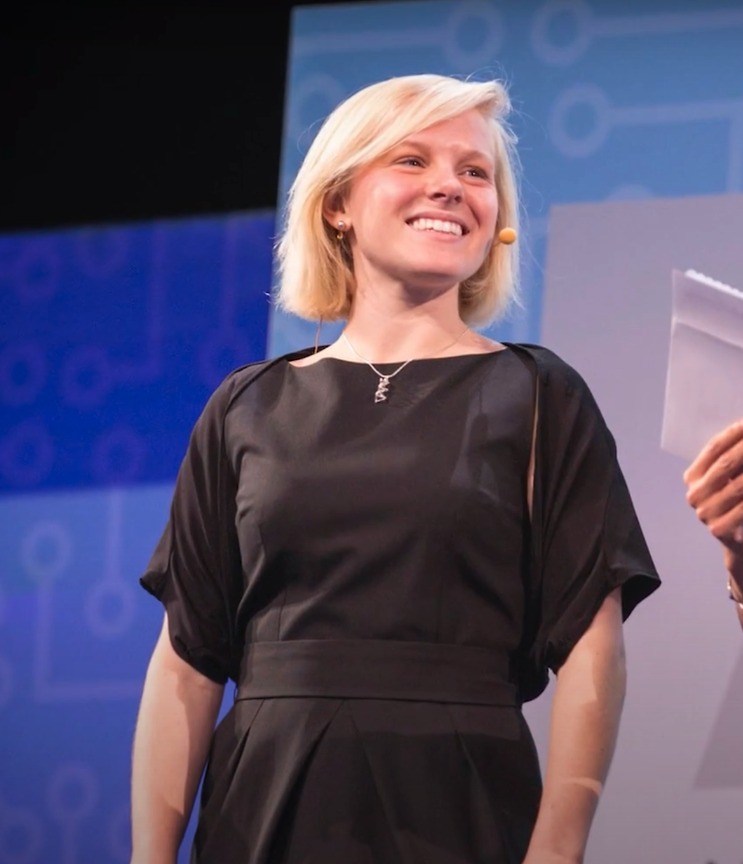 Ashley Mae Conard, Ph.D. on stage at Grace Hopper Celebration