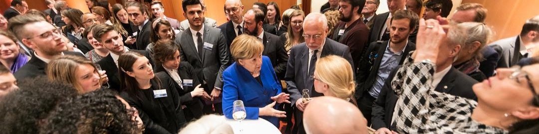 Ashley Conard at a Fulbright reception with Chancellor Angela Merkel