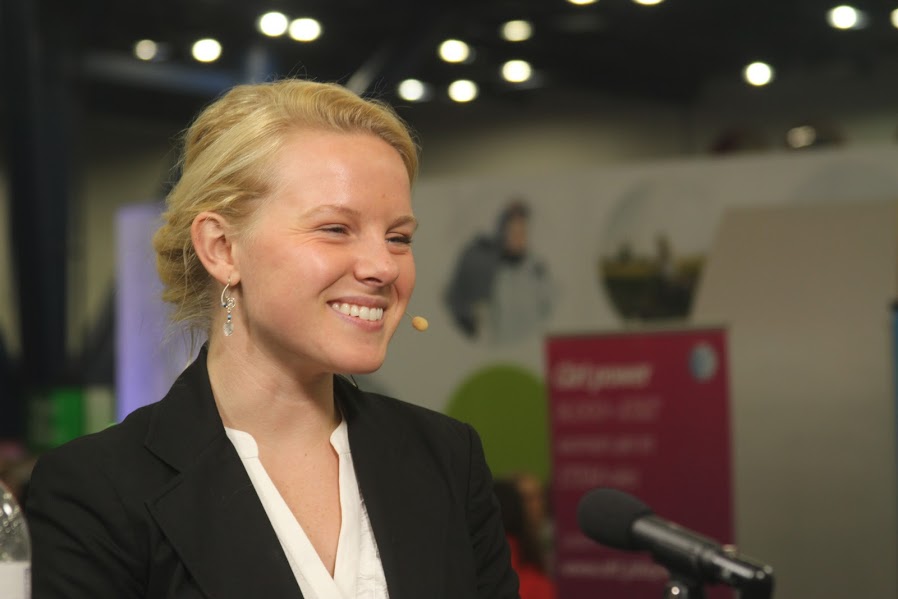 Ashley Mae Conard speaking on a panel at a tech conference