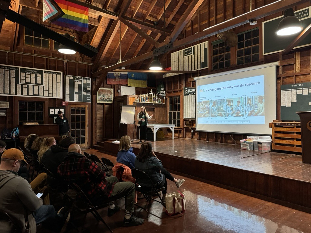 Ashley Mae Conard presenting rare disease research to the patient community at flok